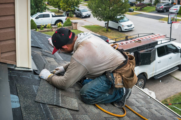 Professional Roofing technician working in Wolflake, IN